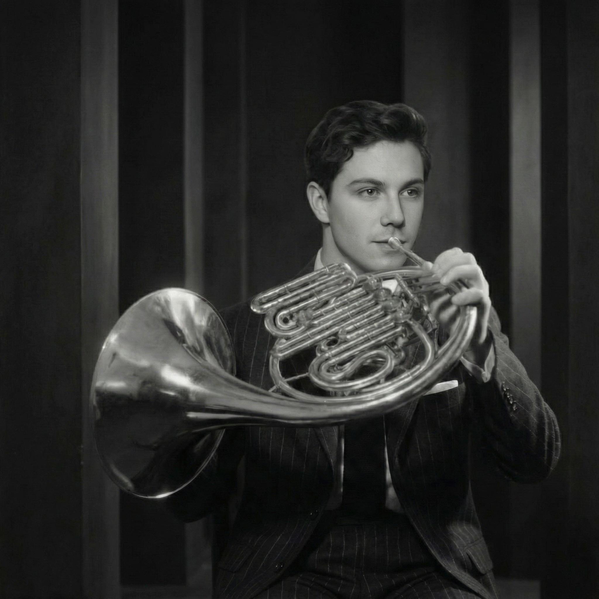 Black and white portrait playing horn beside columns